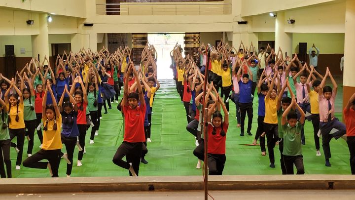 Students practising yoga