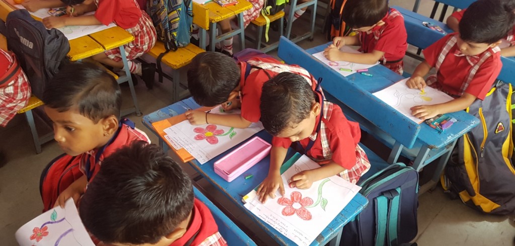 Young students drawing in their classroom
