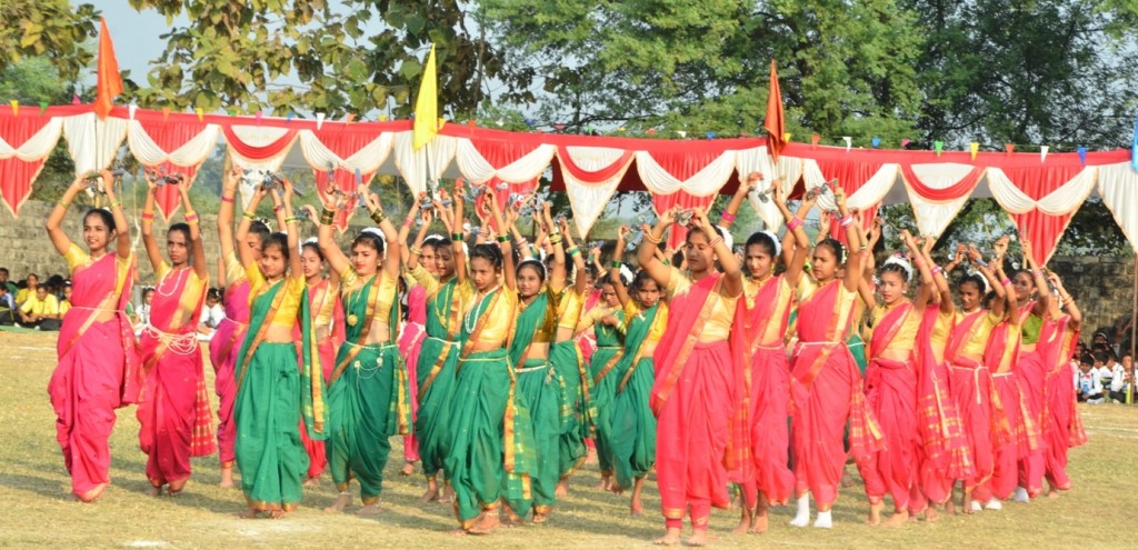 Students performing a folk dance on the school ground